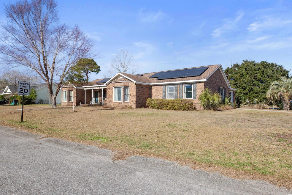 Ranch-style house featuring a front lawn, brick si
