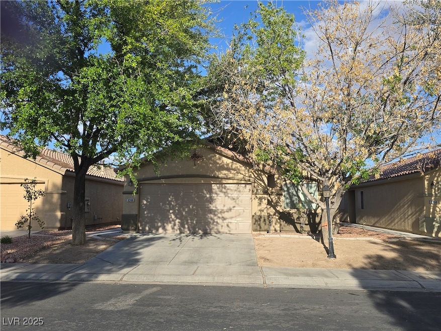 View of front of property featuring concrete drive