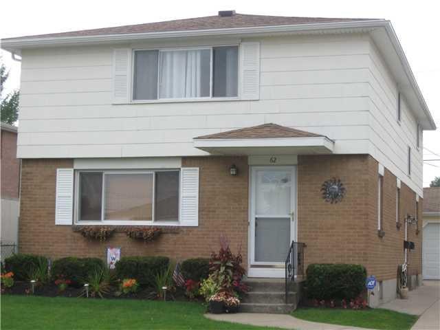 Exterior Front. Very well kept duplex with tear of