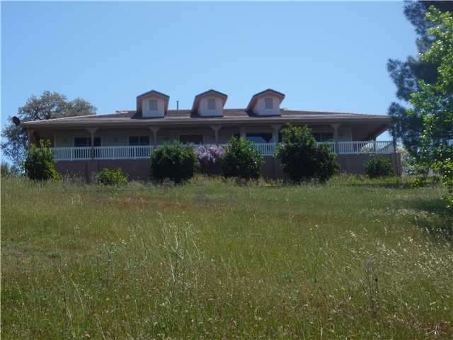 View of the front of home from the meadow in front