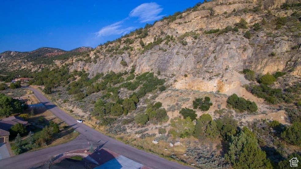 Aerial overview of property's location featuring a mountainous background