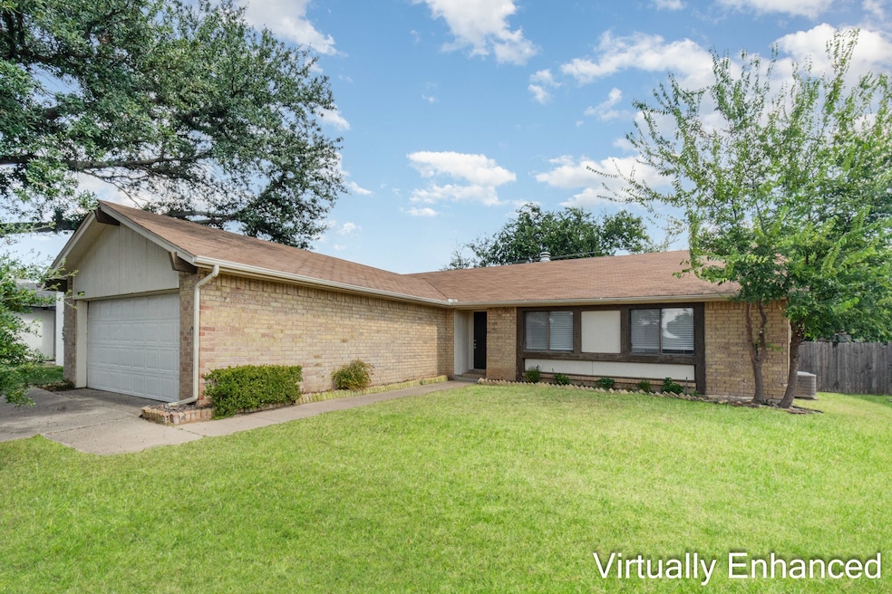 Virtually enhanced Single story home with brick siding, an attached garage, and a shingled roof
