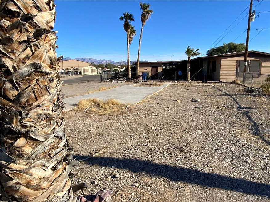 View of yard and patio slab (from previous mobile