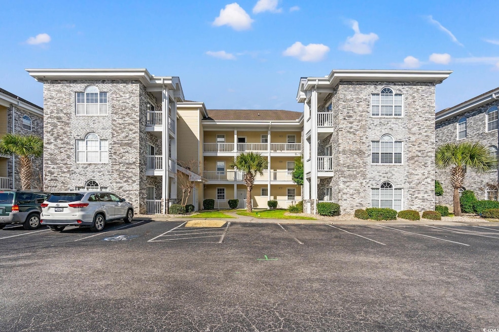 View of property with uncovered parking