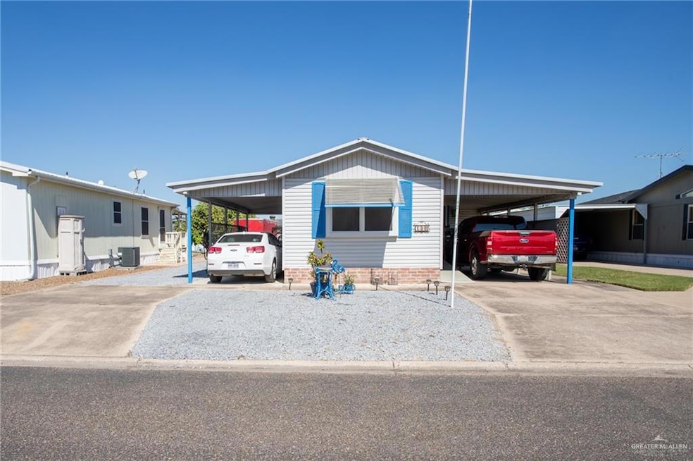 Manufactured / mobile home with an attached carport and driveway