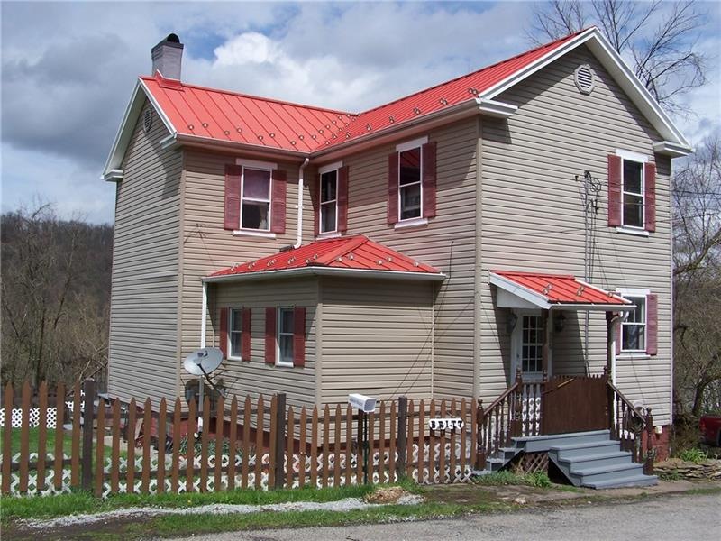 Exterior Front of home with vinyl siding and metal