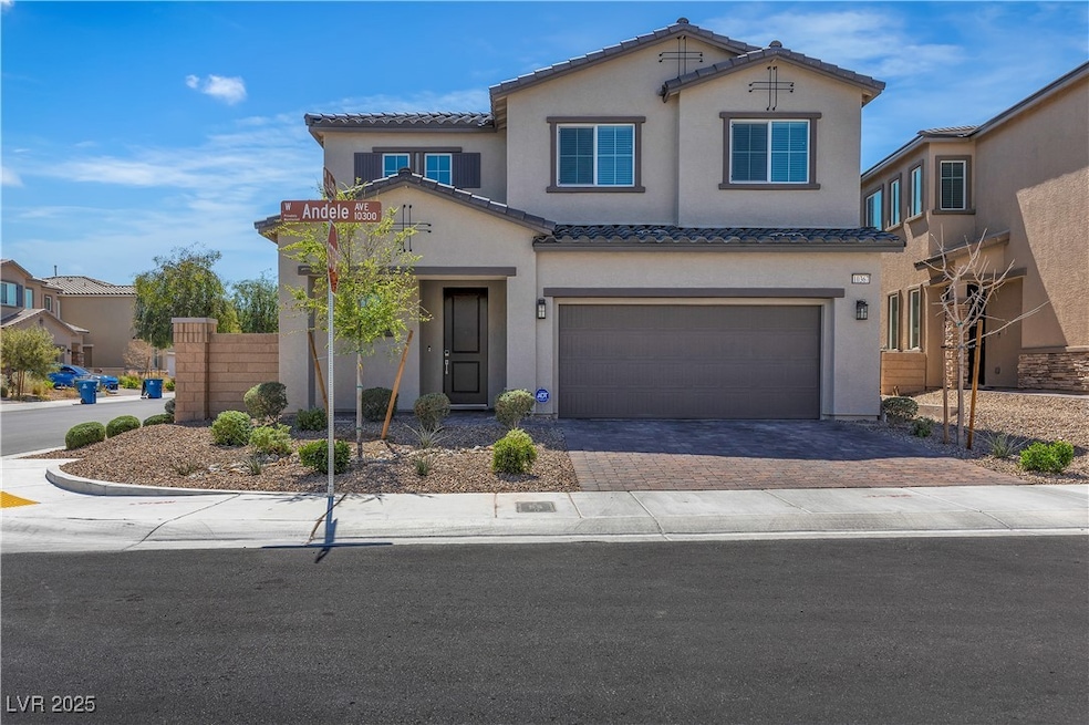View of front of home featuring driveway, fence, a