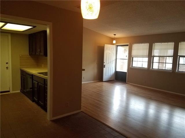 Kitchen / Dining view into Family Room and Front E