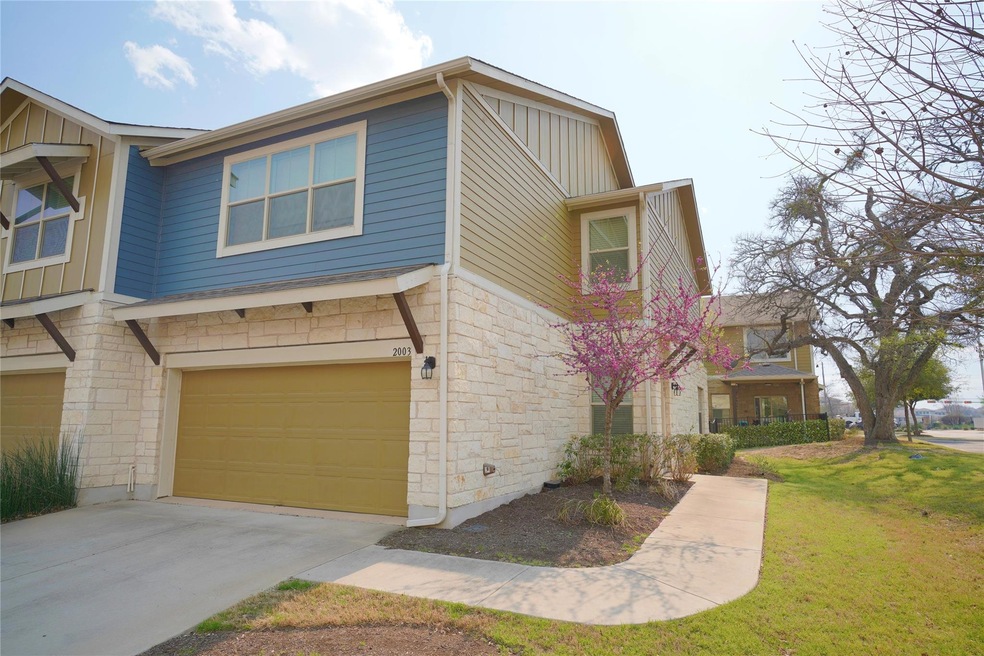 View of front of home featuring stone siding, boa