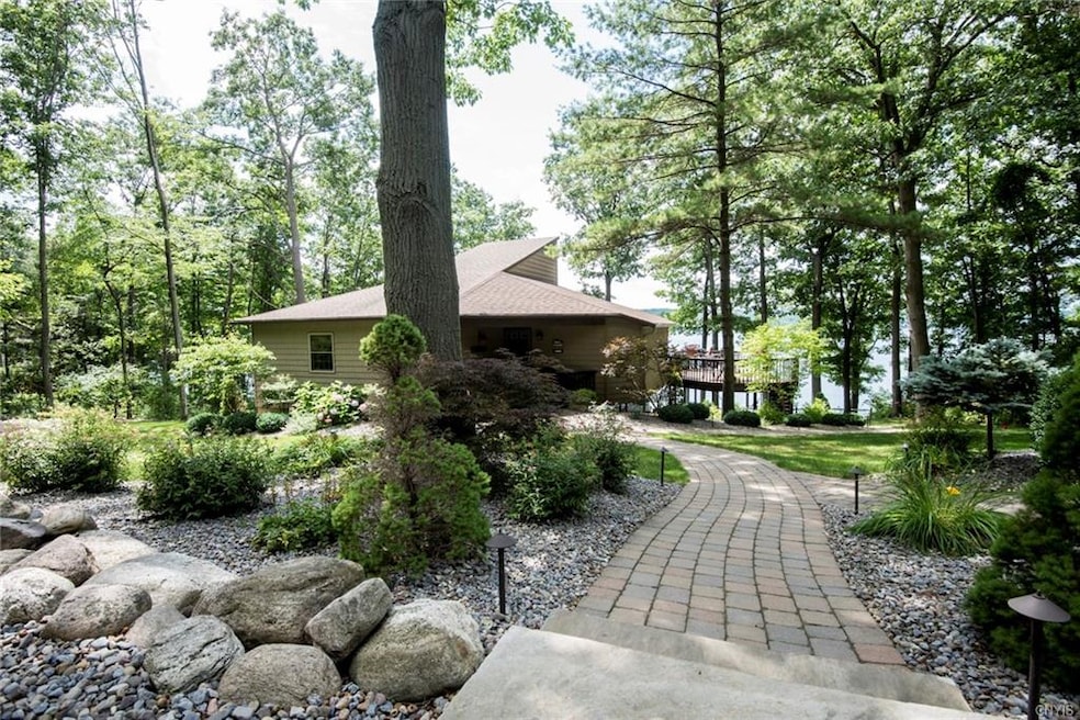 Walk leading from parking area to house, with view