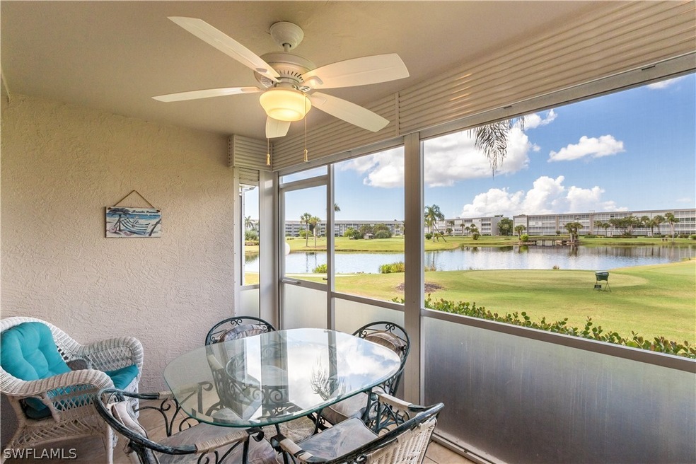 Expansive view of golf course and lake from lanai