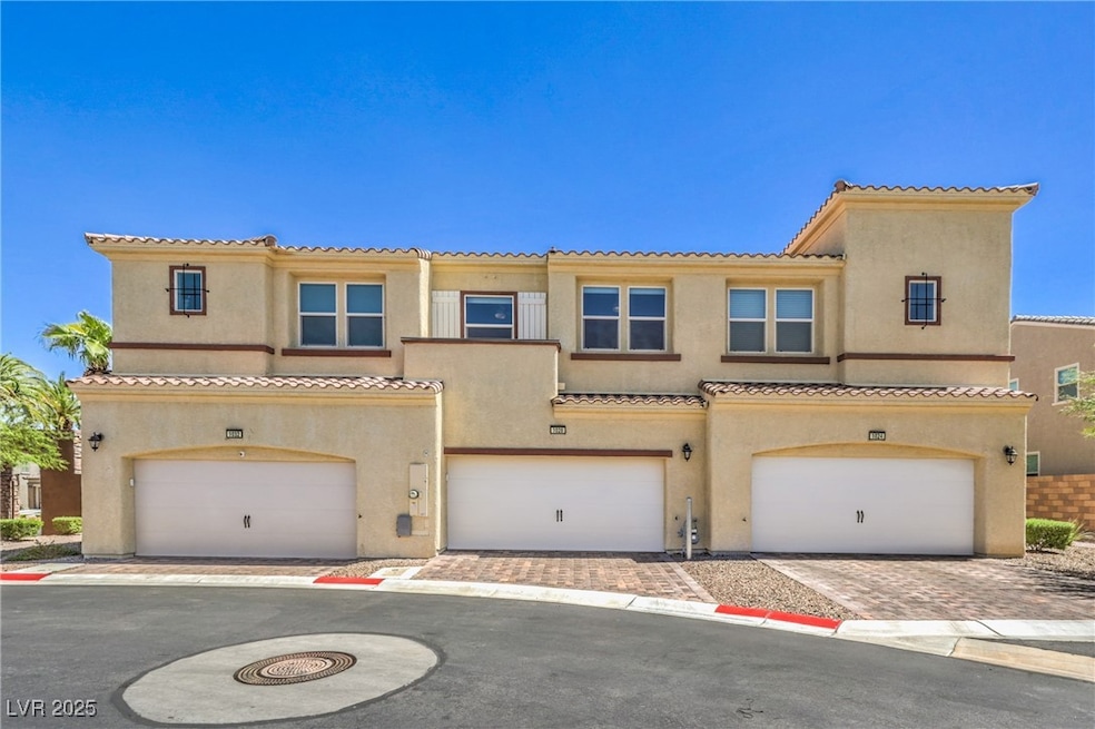 View of front facade with decorative driveway, a t