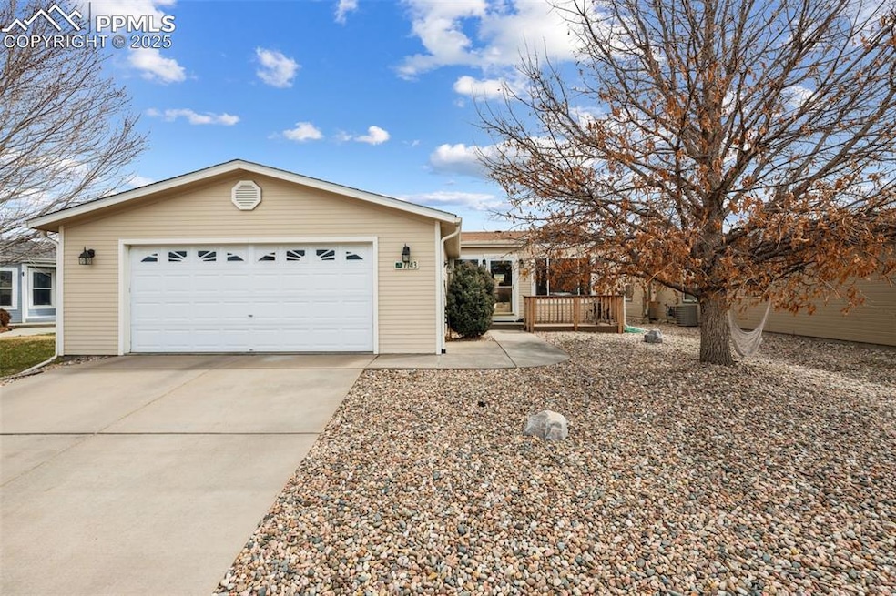 Single story home featuring driveway and an attached garage