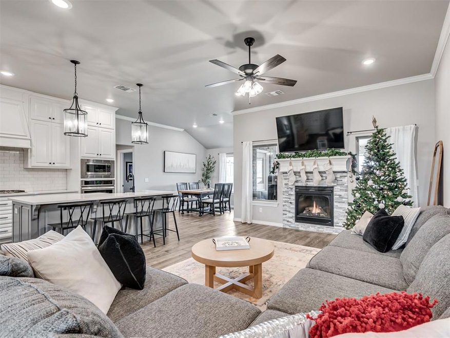 Living room with light wood-type flooring, ceiling