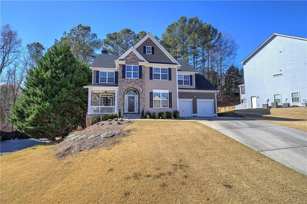 View of front of property featuring a garage and a