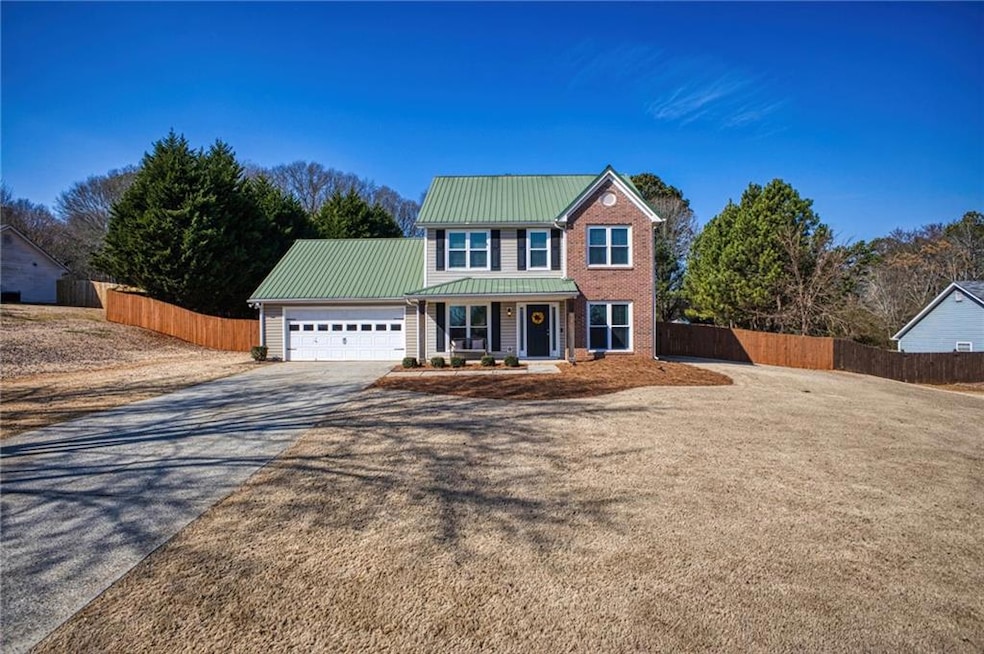 View of front of property featuring a garage