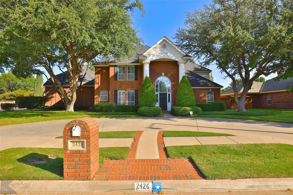 Gorgeous and stately 2-story home features circle 