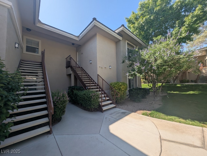 Doorway to property featuring stucco siding and a