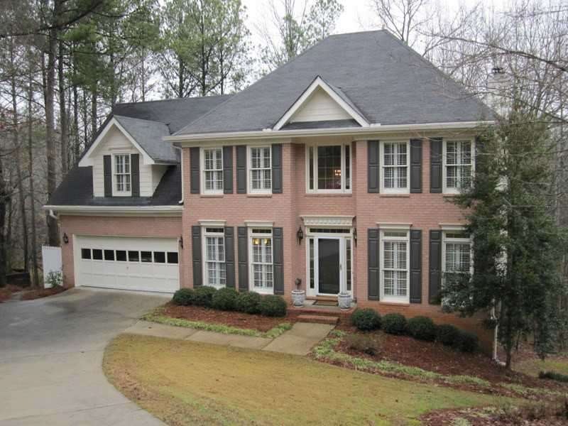 Exterior Front. Brick Traditional home nestled in 