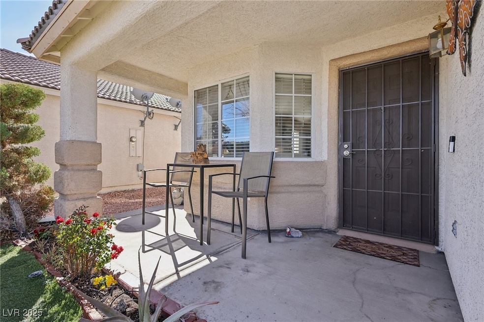 Doorway to property featuring a patio area