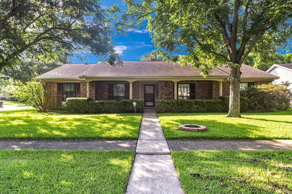 Gorgeous 1-story home surrounded by lovely trees