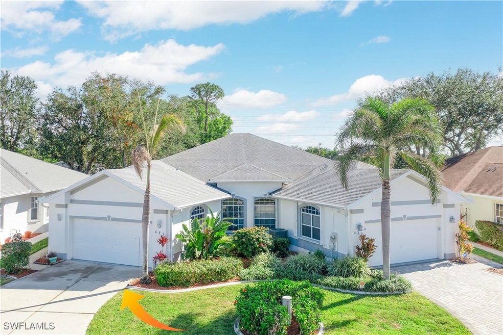 Single story home featuring a garage and a front y