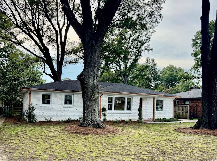 Ranch-style home with brick siding