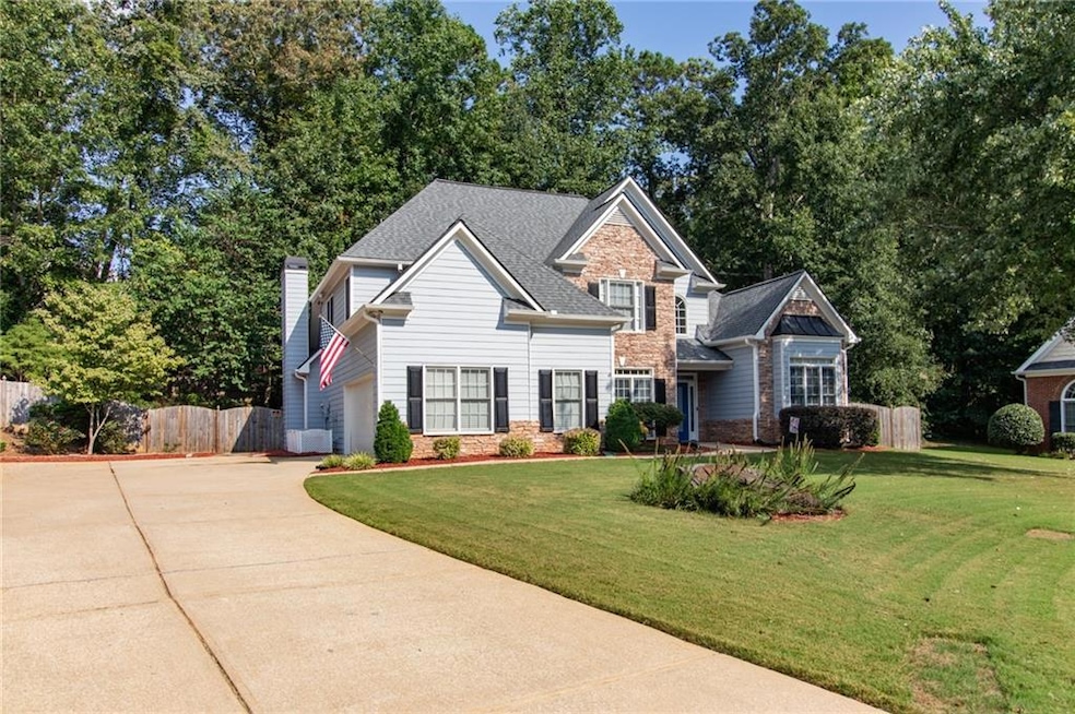 Craftsman-style home featuring a front lawn