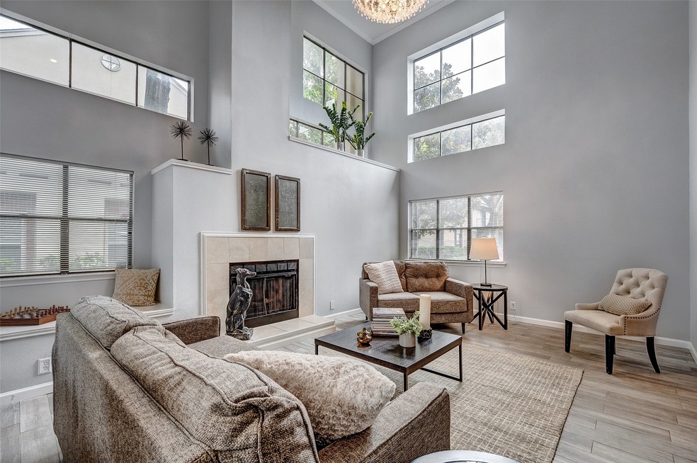 Open and airy living room features neutral paint,