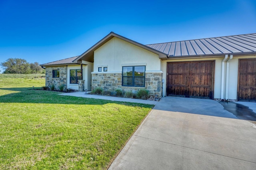 View of front of property with stucco siding, met