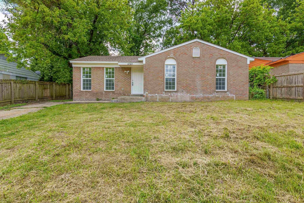 Single story home with brick siding