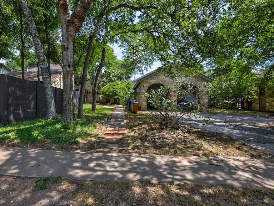 View of front of property with stone siding and d