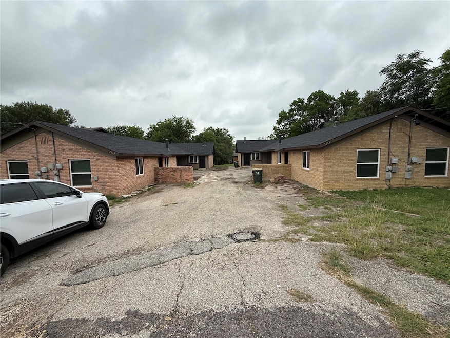View of front of property featuring brick siding 