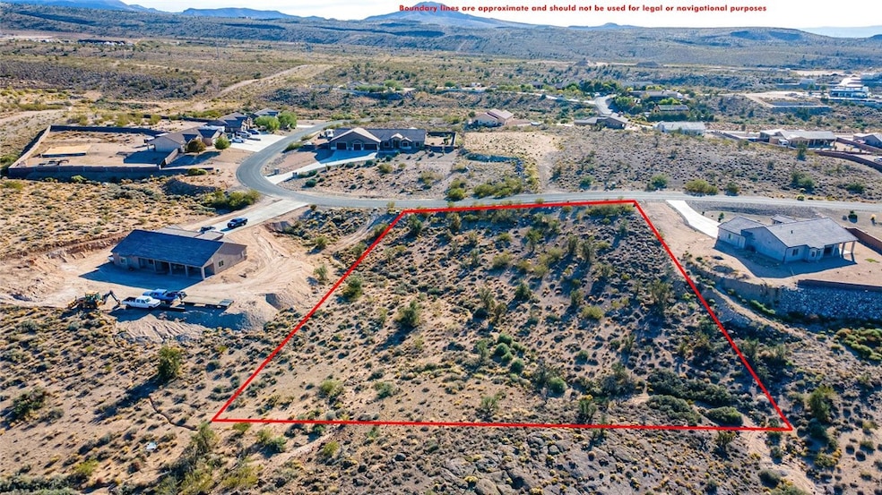 Aerial view of property's location featuring a mountain backdrop and property boundaries highlighted