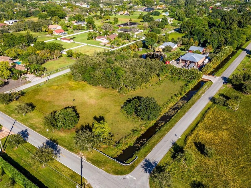 Unique 2+ acre double corner lot with canal, perfe