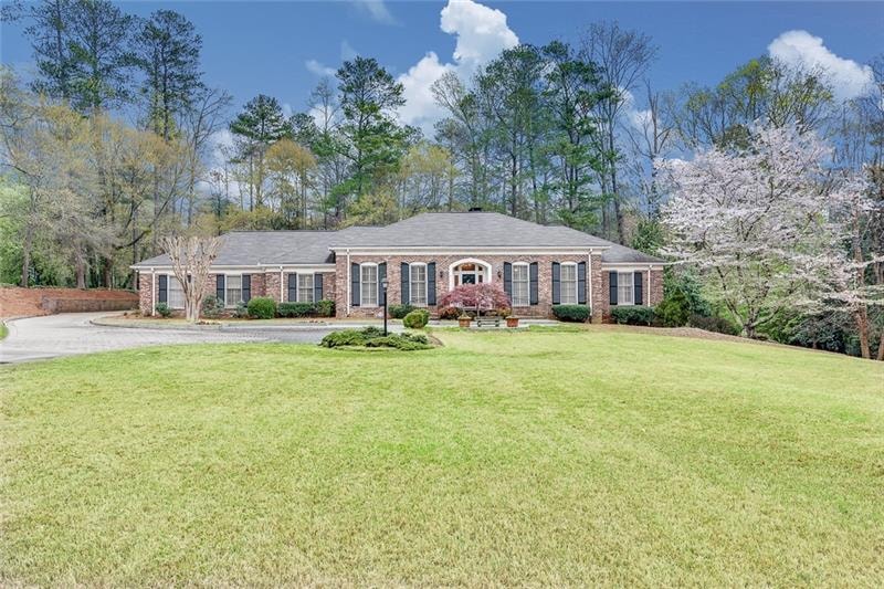 All brick traditional ranch rests on an acre plus 