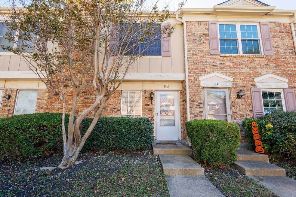 View of front of house with brick siding
