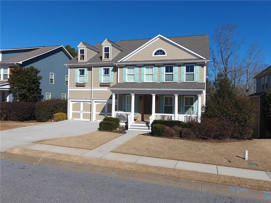Inviting front porch and adorable front elevation