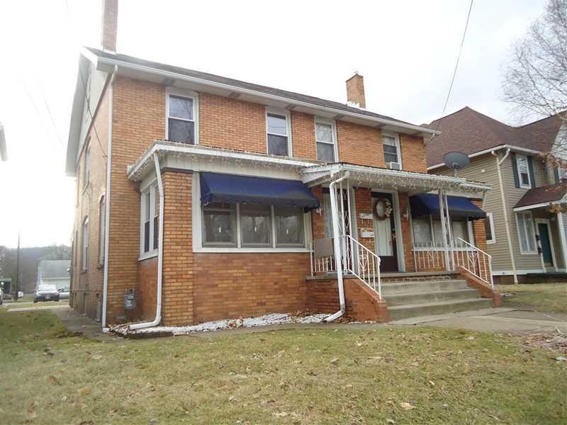 Exterior Front. All brick.  One side is rented, on