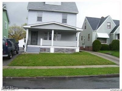 View of front of home featuring a porch and a front lawn