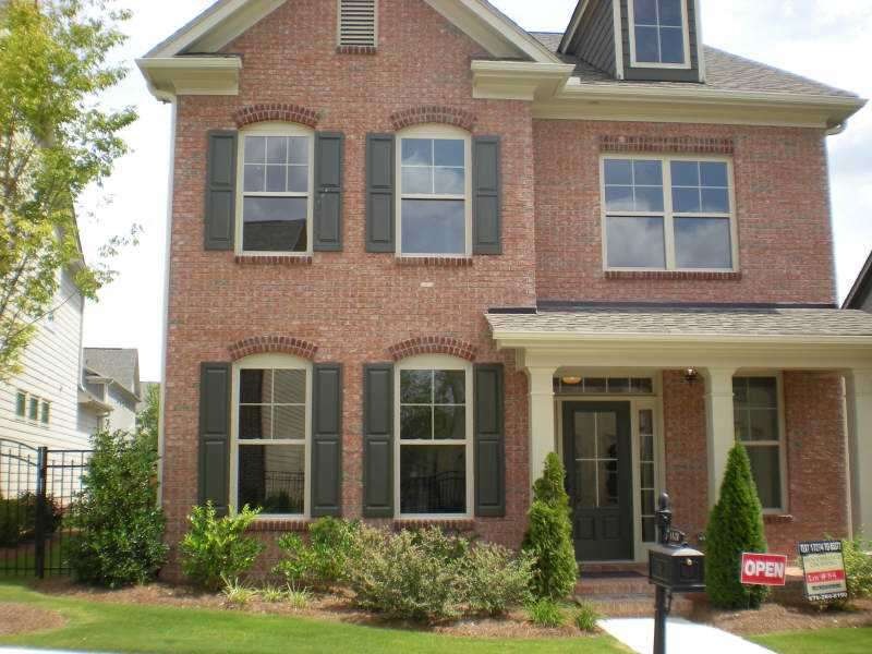 Exterior Front. Brick front with a cozy front porc