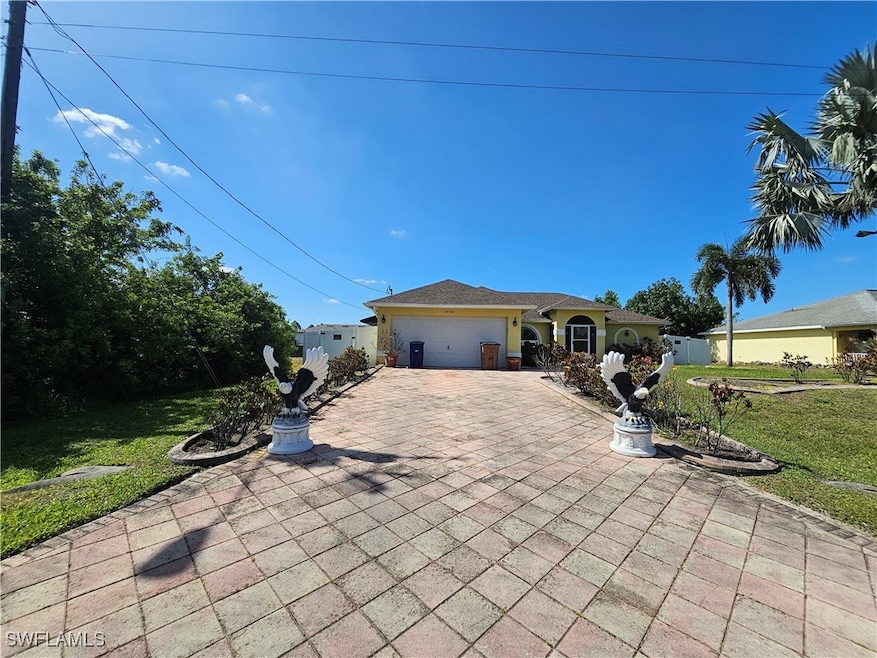 View of front of house featuring a garage, a front