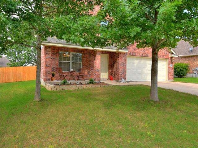 Two large trees shade the home in this wonderful n