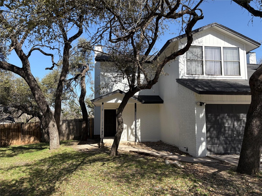 View of side of home with a yard, brick siding, f