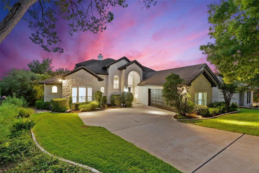 French country inspired facade featuring an attac