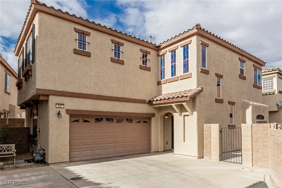 Mediterranean / spanish house with a garage, concr