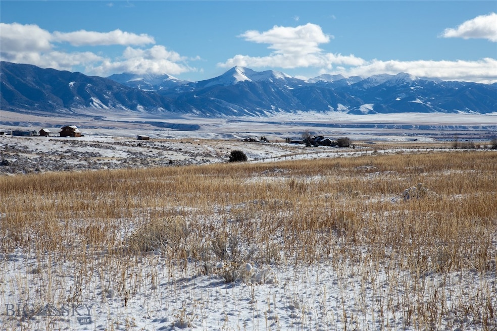 Property view of mountains and Ennis Lake
