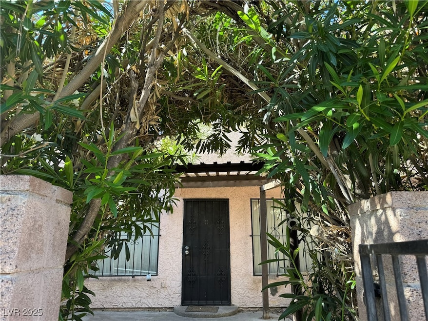 Entrance to property featuring stucco siding