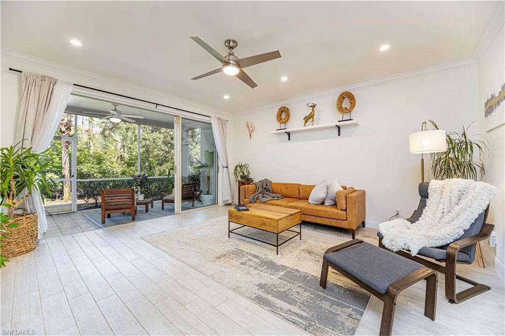Living area featuring ceiling fan, ornamental molding, recessed lighting, and light wood-style floors