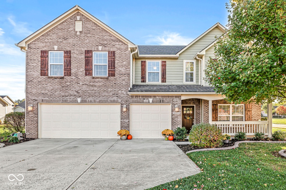 Inviting curb appeal.  Front elevation features brick, composition cement siding, covered front porch, 3 bay auto garage.  It looks roomy and at over 3150 sq. ft. with a great floor plan, it is!  Room to Relax!